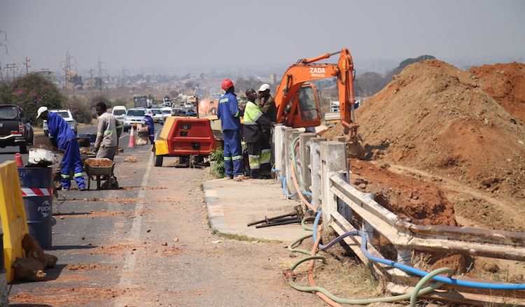 Photo: As infrastructural boom spreads across Southern Africa, in Zimbabwe, workmen are busy on highways giving an upgrade to the country's major roads. Credit: Jeffrey Moyo | IDN-INPS